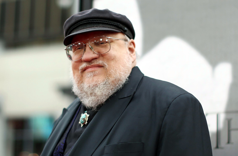 FILE - In this March 18, 2013 file photo, author George R.R. Martin arrives at the premiere for the third season of the HBO television series "Game of Thrones" at the TCL Chinese Theatre in Los Angeles. The author this week posted an excerpt from his very-long awaited ìThe Winds of Winter,î the sixth novel in his ìA Song of Ice and Fireî series. The excerpt focuses on Princess Arianne Martell and her reports back to her father, Prince Doran Martell of Dorne. (Photo by Matt Sayles /Invision/AP, File)